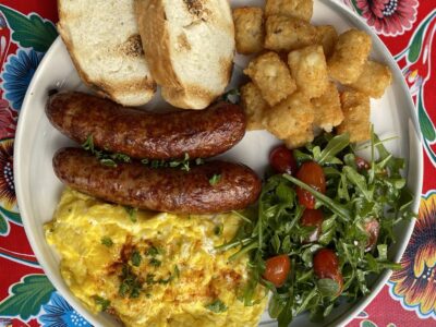 Grilled chicken apple sausage and eggs served for breakfast at Poboys Kitchen in San Francisco