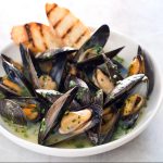 Mussels in white wine lemon garlic sauce served at Poboys Kitchen in San Francisco
