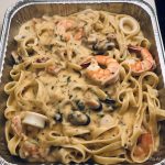 Catering-size seafood fettuccini pasta prepared by Poboys Kitchen in San Francisco