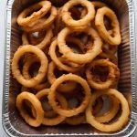 Catering-size onion rings prepared by Poboys Kitchen in San Francisco