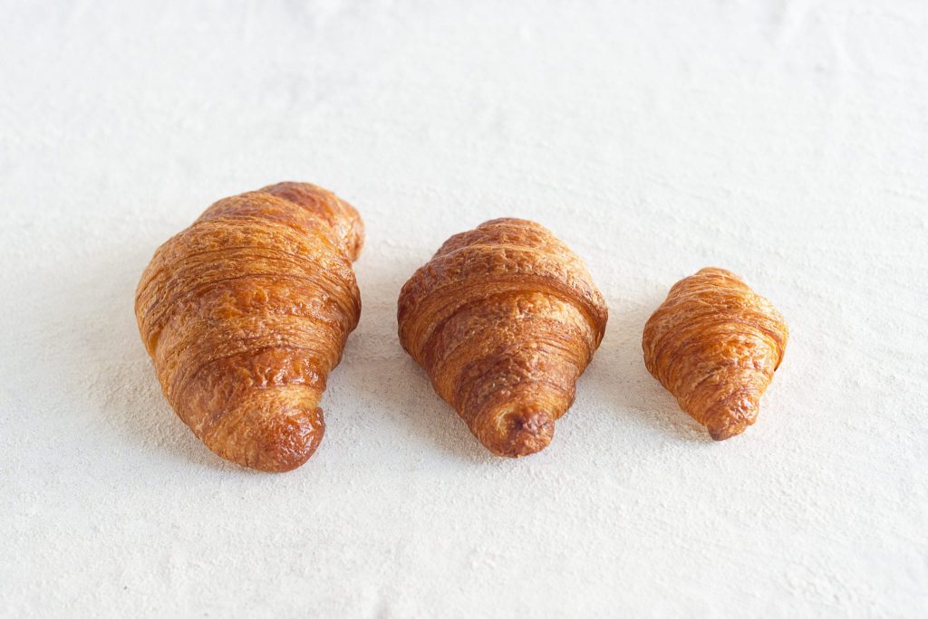 Catering-size dozen plain or chocolate croissants prepared by Poboys Kitchen in San Francisco