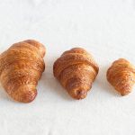 Catering-size dozen plain or chocolate croissants prepared by Poboys Kitchen in San Francisco