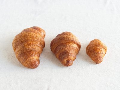 Catering-size dozen plain or chocolate croissants prepared by Poboys Kitchen in San Francisco